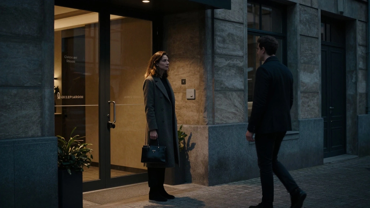 A woman waits respectfully in a Lille apartment lobby, meeting a client with discretion and dignity.